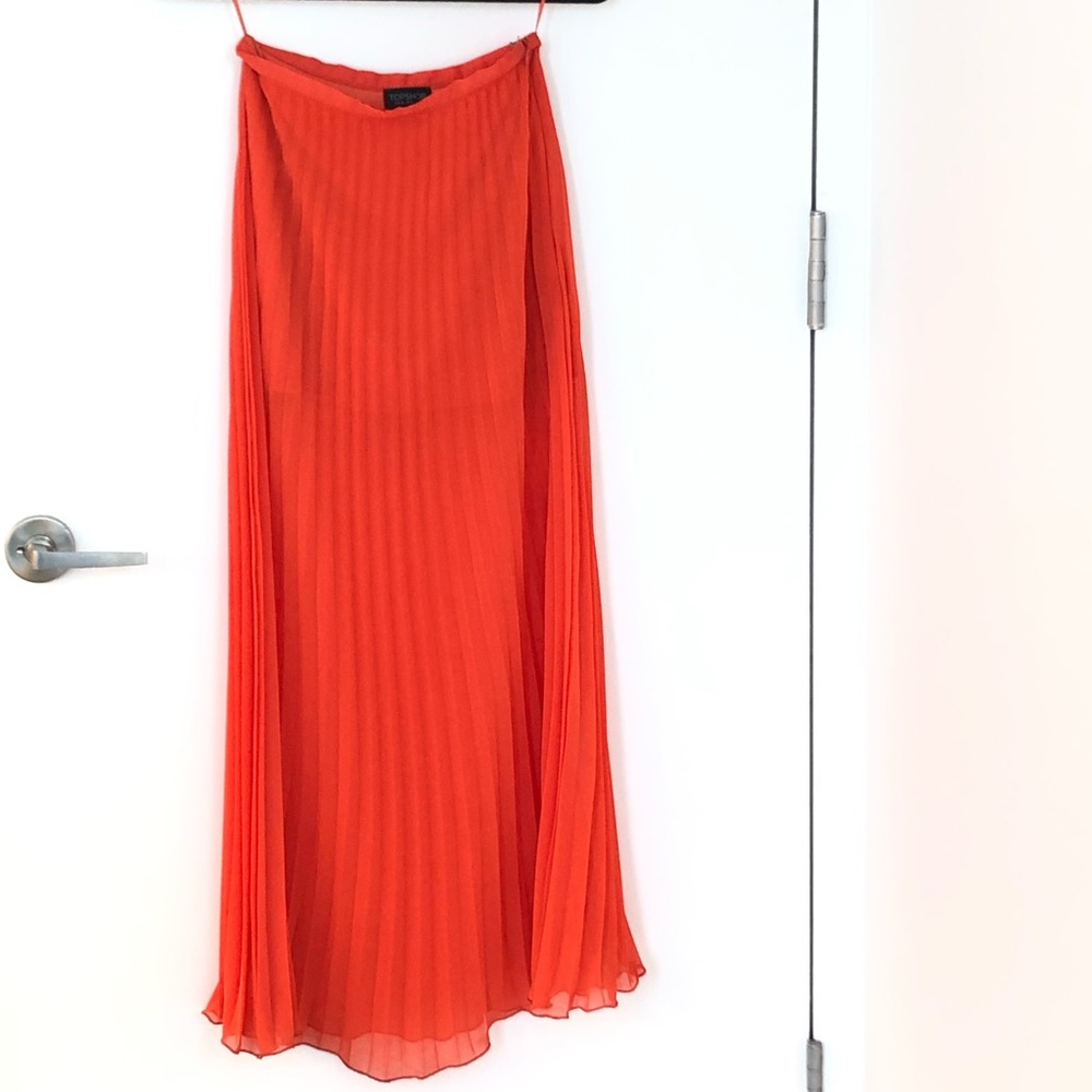 Neon orange pleated skirt
